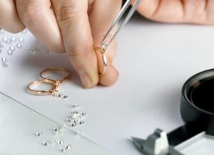 Someone crafting a bespoke diamond ring